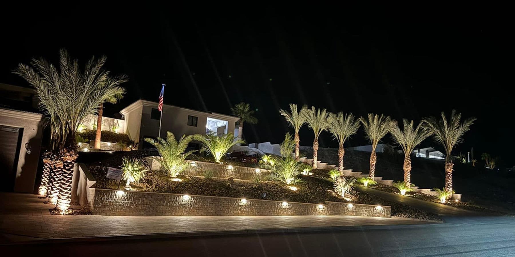Tiered retaining wall with landscape lighting -- Havasu Pavers signature project